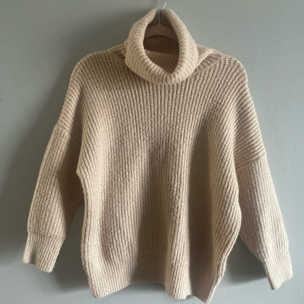 Neutral tan knit chunky turtleneck sweater